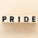 The word "pride" on wooden blocks