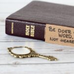 Bible with a note: Be doer of the word, not hearer only!
